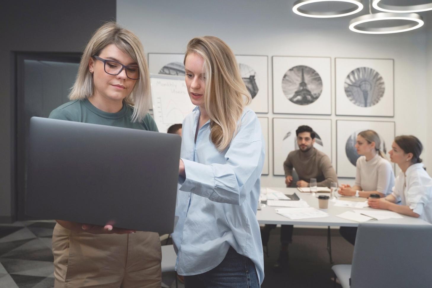 Students working on advanced system configuration in modern computer lab